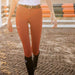 Ego 7 pantalon d'équitation femme CSO. Modèle Jumping EJ. Couleur orange brique. Vendu par Sellerie Fouilhoux